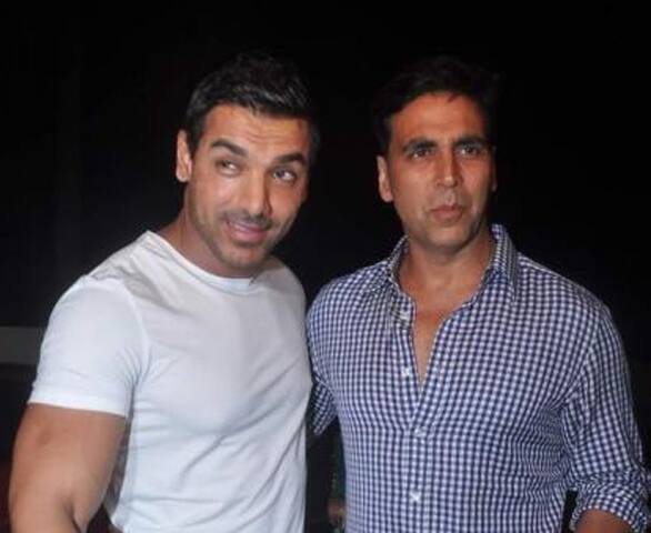 John Abraham escorts Akshay Kumar to the special screening of 'Vicky Donor' which has been produced by John.