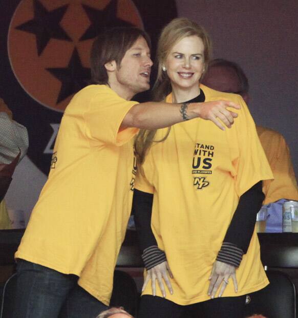 Singer Keith Urban  and wife, actress Nicole Kidman watch the Nashville Predators play the Detroit Red Wings in the first period of Game 5 of a first-round NHL hockey playoff series in Nashville, Tenn.