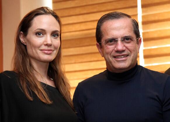 Ecuador's Foreign Minister Ricardo Patino and US actress and UNHCR's Goodwill Ambassador Angelina Jolie pose for pictures during a meeting in Quito.