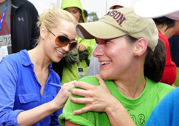 Singer Kellie Pickler signs autographs at the 5K Run during the inaugural Nicholas Sparks Celebrity Family Weekend in New Bern, North Carolina.