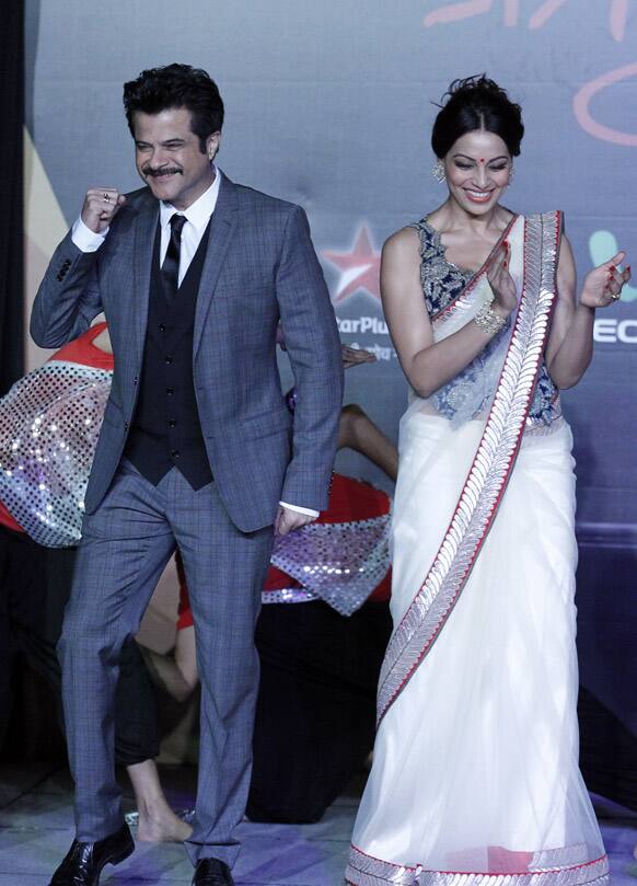 Anil Kapoor and Bipasha Basu, dance as they arrived at the International Indian Film Academy's Weekend and Awards media conference in Singapore.