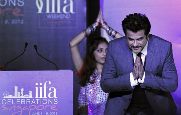 Anil Kapoor greets media as he arrives at the International Indian Film Academy's (IIFA) Weekend and Awards media conference, in Singapore