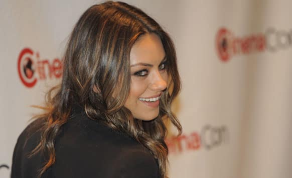 Mila Kunis  poses before the Walt Disney Studios Motion Pictures presentation at CinemaCon 2012, the official convention of the National Association of Theater Owners.