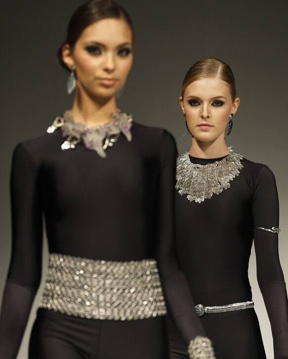 Models wear creations by Peru's ILARIA during the second edition of the Lima Fashion Week.