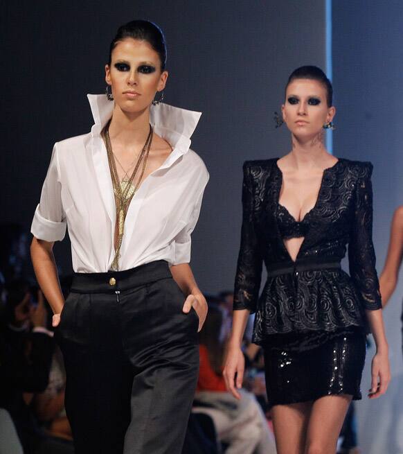 Models wear creations by Peru's Gerardo Privat during the second edition of the Lima Fashion Week.