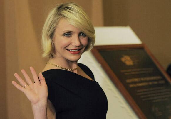 Actress Cameron Diaz waves to photographers at the annual 