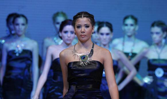 Models wear creations by Peru's Christian Davila jewellery designers during the second edition of the Lima Fashion Week in Lima, Peru.