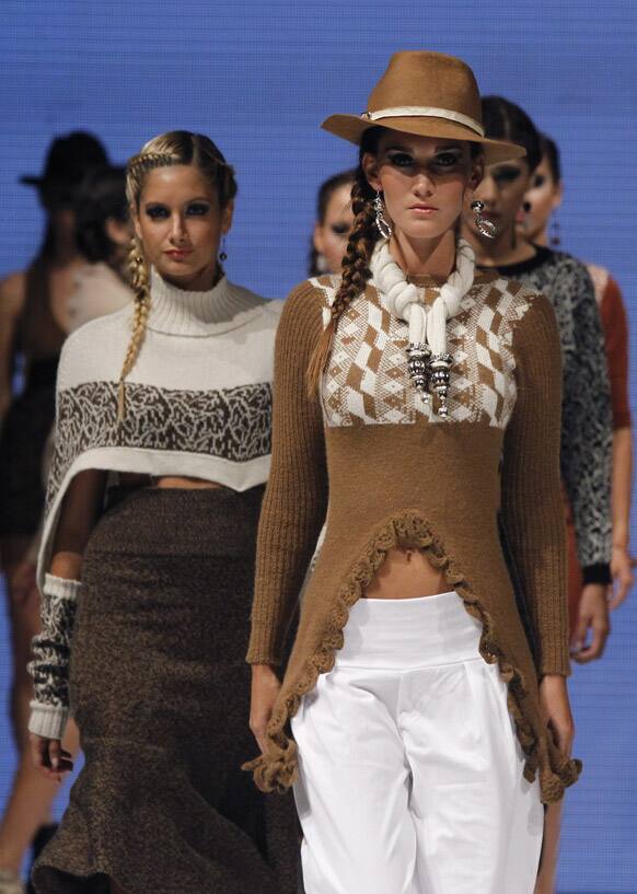 Models wear creations by Peru's Yanira Cardenas during the second edition of Lima Fashion Week in Lima.