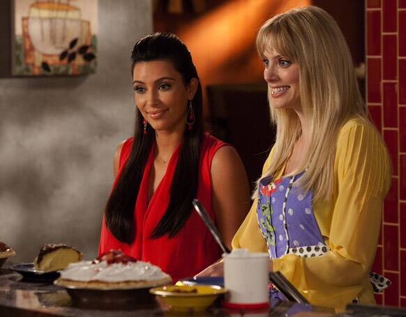 TV personality Kim Kardashian , left, is shown with April Bowlby in a scene from the season 4 premiere of the Lifetime series, 