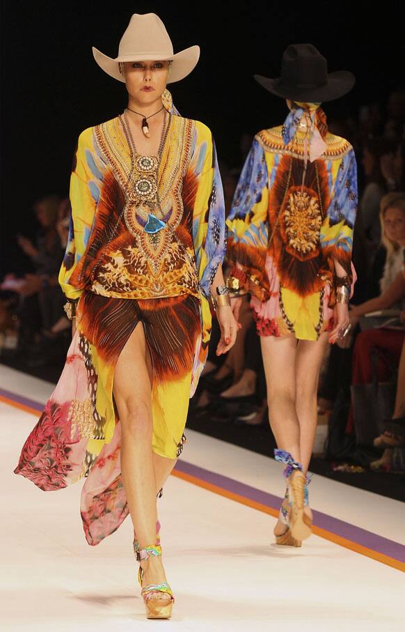 Models wear outfits from designer Camilla during Fashion Week Australia in Sydney.