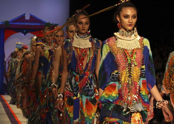 Models wear outfits from designer Camilla during Fashion Week Australia in Sydney.