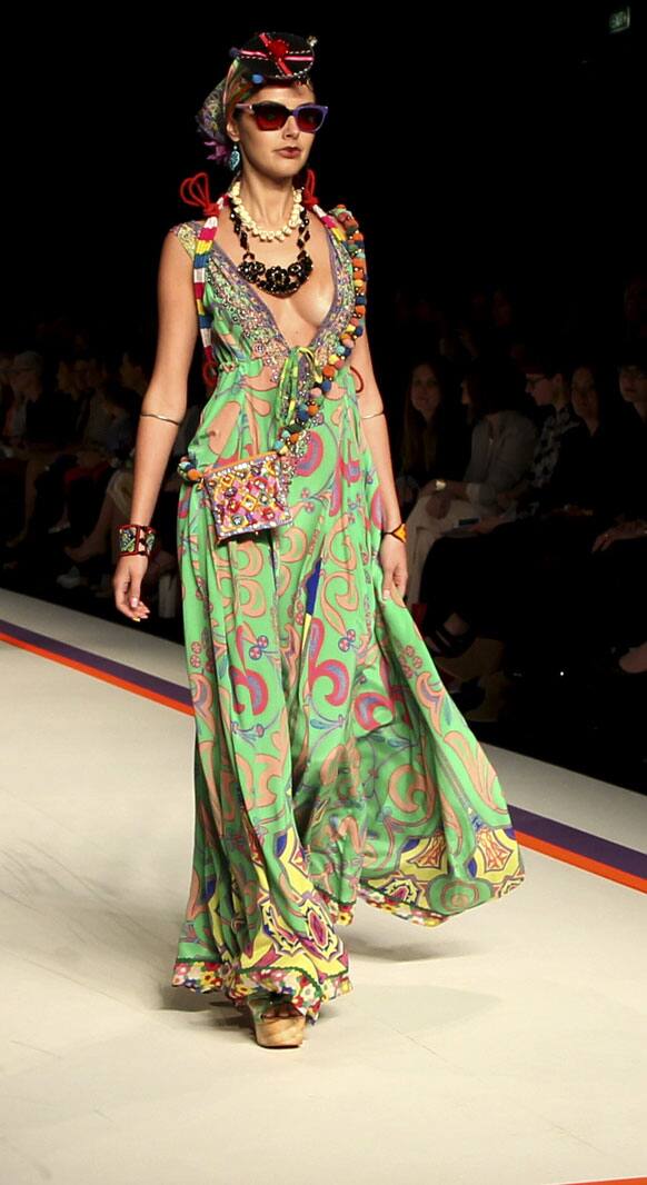 A model wears an outfit from designer Camilla on the runway during Fashion Week Australia in Sydney.