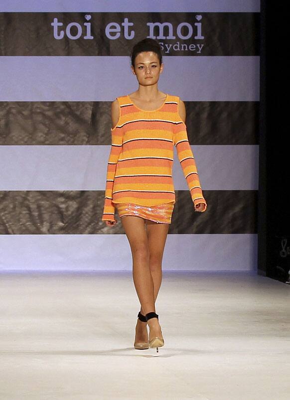 A model wearing an outfit from designer Toi Et Moi Sydney struts along the runway during Fashion Week Australia in Sydney.