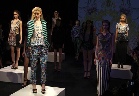 Models wear creations designed by Sara Phillips during Fashion Week Australia in Sydney.