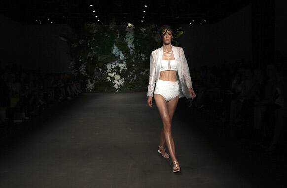 A model wearing designs from Bec & Bridge struts along the runway during Fashion Week Australia in Sydney.