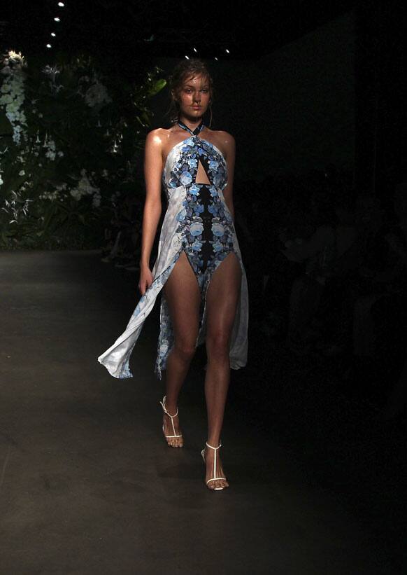 A model wearing designs from Bec & Bridge struts along the runway during Fashion Week Australia in Sydney.