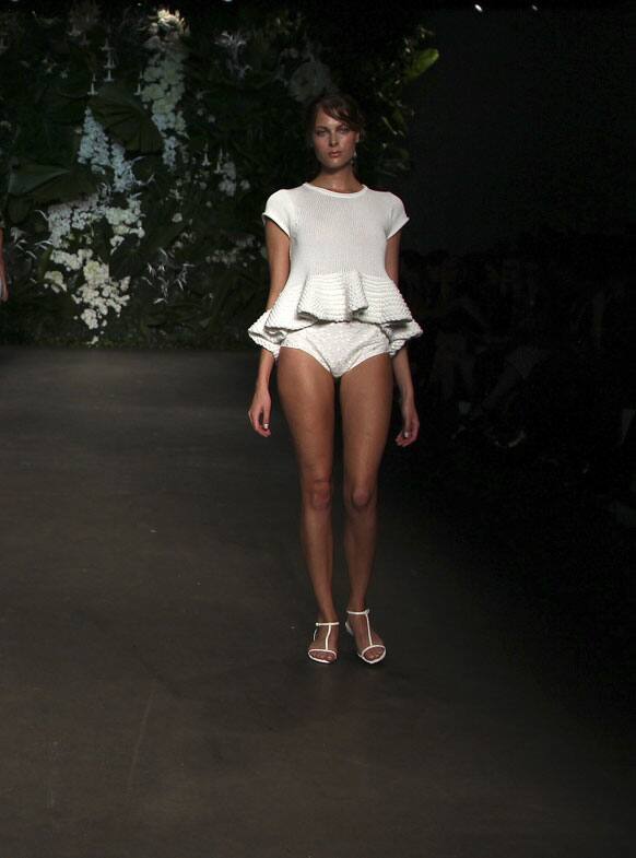 A model wearing designs from Bec & Bridge struts along the runway during Fashion Week Australia in Sydney.