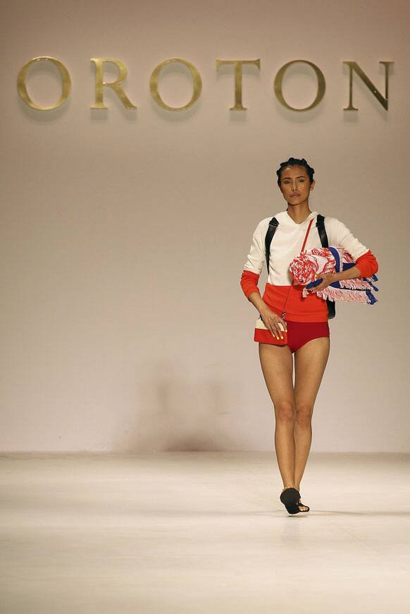 A model wearing designs from Oroton struts along the runway during Fashion Week Australia in Sydney.