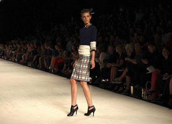 A model wearing designs from Oroton stands on the runway during Fashion Week Australia in Sydney.