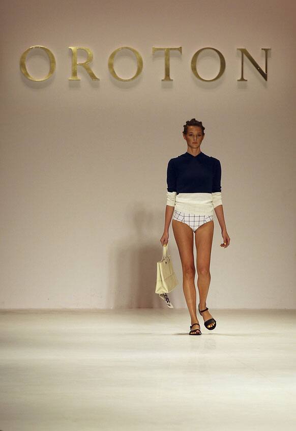 A model wearing designs from Oroton struts along the runway during Fashion Week Australia in Sydney.