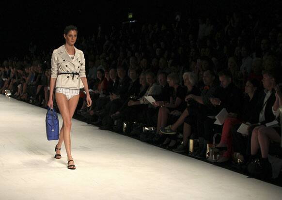 A model wearing designs from Oroton struts along the runway during Fashion Week Australia in Sydney.