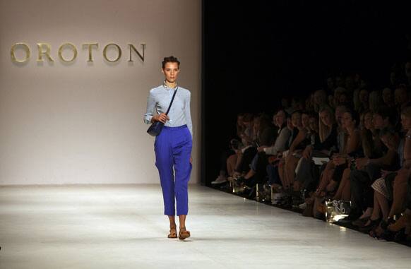 A model wearing designs from Oroton struts along the runway during Fashion Week Australia in Sydney.