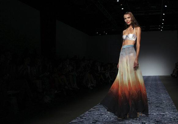 A model wearing a design from We Are Handsome stands at the end of the runway during Australian Fashion Week in Sydney.