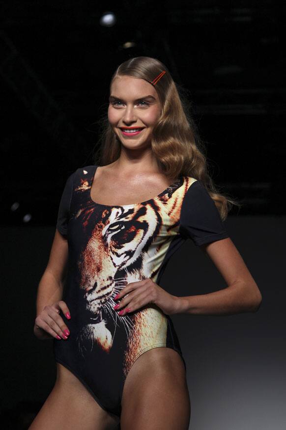 A model wearing a design from We Are Handsome stands at the end of the runway during Australian Fashion Week in Sydney.