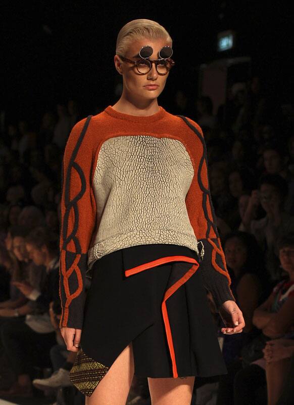 A model struts along the runway wearing a design by Kaylene Milner during Australian Fashion Week in Sydney.