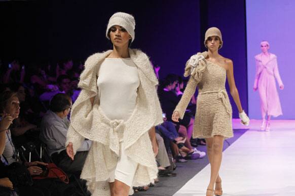 Models wear creations by Peru's Jenny Duarte during the second edition of the Lima Fashion Week in Lima.