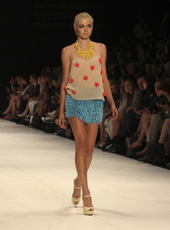 A model struts along the runway wearing a design by Cynthia Thai during Australian Fashion Week in Sydney.