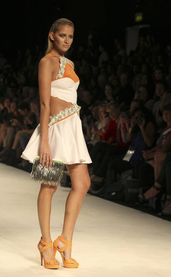 A model struts along the runway wearing a design by Cynthia Thai during Australian Fashion Week in Sydney.