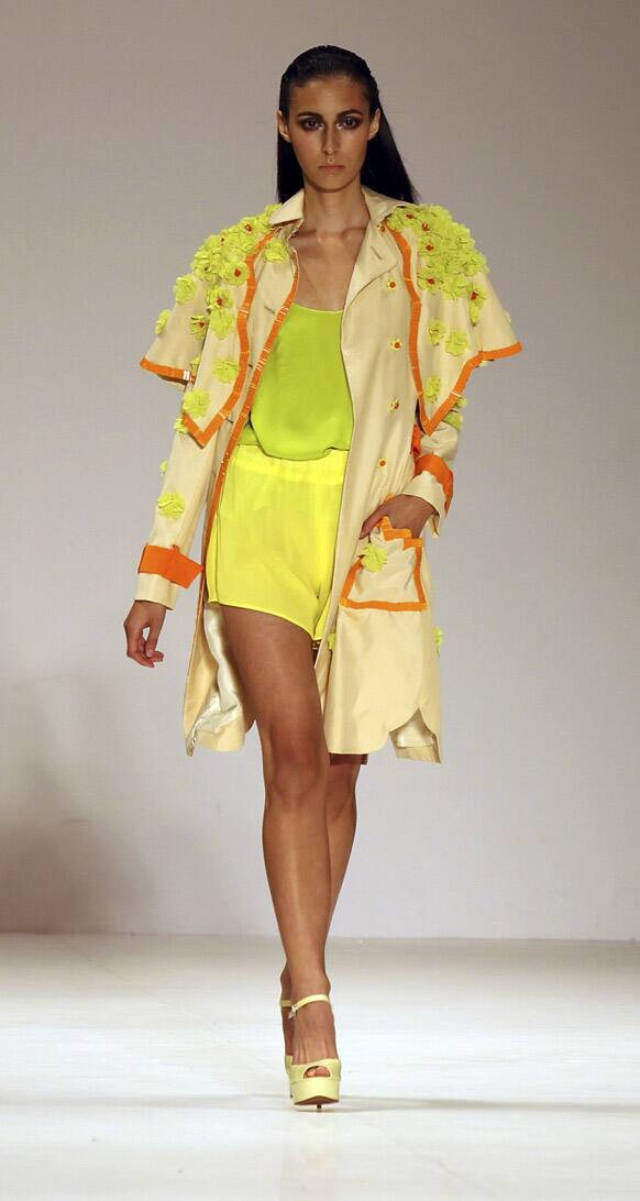 A model struts along the runway wearing a design by Cynthia Thai during Australian Fashion Week in Sydney.