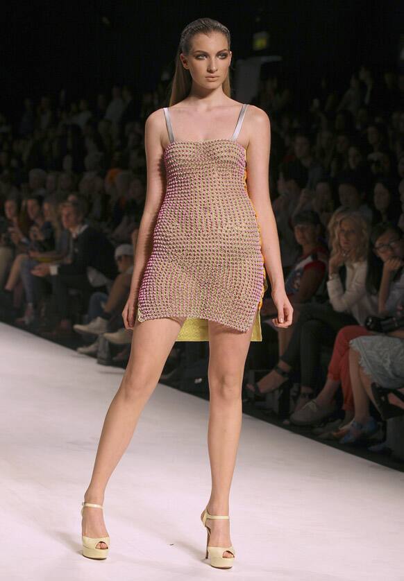 A model struts along the runway wearing a design by Cynthia Thai during Australian Fashion Week in Sydney.