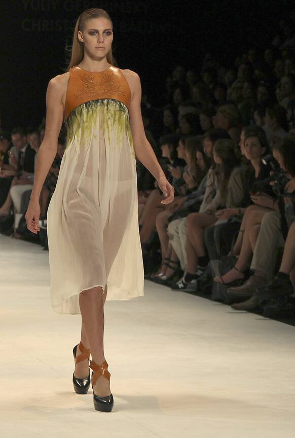 A model struts along the runway wearing a design by Kaylene Milner during Australian Fashion Week in Sydney