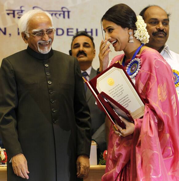 Vidya Balan acknowledges Vice President Hamid Ansari after receiving the Best Actress award for her film Dirty Picture during the 59th National Film Award 2011 in New Delhi.