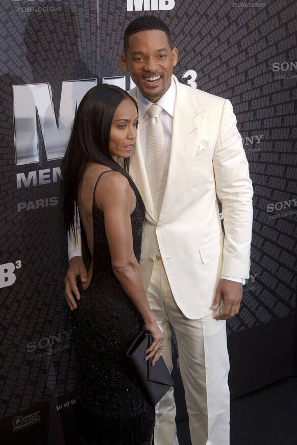 American actor Will Smith, right, and his wife Jada Pinkett Smith, pose as they arrive for the French Premiere of 