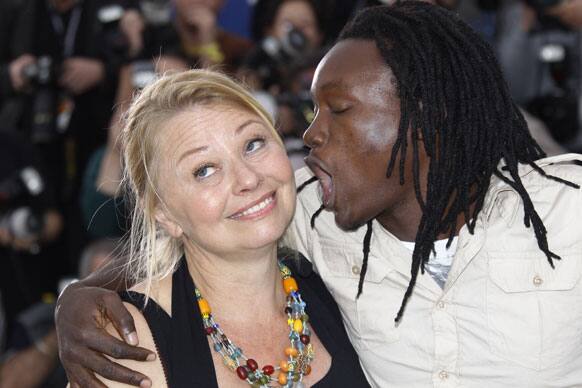 Actors Margarethe Tiesl, left and Peter Kazungu pose during a photo call for Paradise: Love at the 65th international film festival, in Cannes.