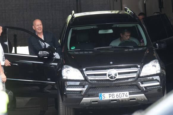 US actor Bruce Willis gets ready for action in his car, on the film set in Budapest, Hungary.