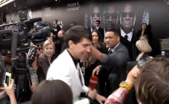 U.S. actor Will Smith slaps reporter Vitalii Sediuk, from the Ukrainian television channel 1+1 on the red carpet before the premiere of 