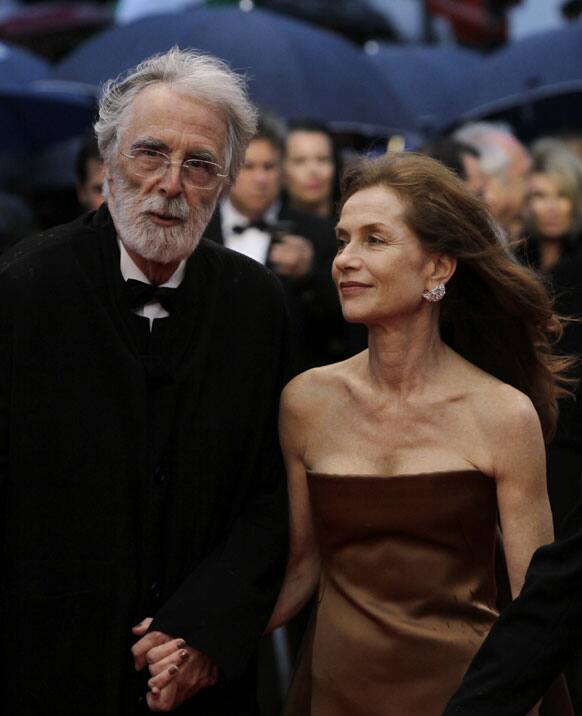 Director Michael Haneke, left and actress Isabelle Huppert arrive for the screening of Love at the 65th international film festival, in Cannes.