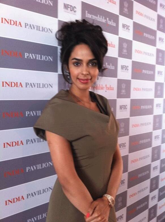 Mallika Sherawat covered up! The actress was clicked at NFDC's India pavilion.