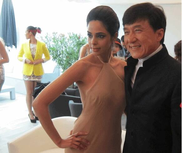 Mallika Sherawat caught up with her 'Myth' co star Jackie Chan at the Cannes Film Festival. Mallika was spotted wearing a nude colour gown which was an Ali Madhavi creation.