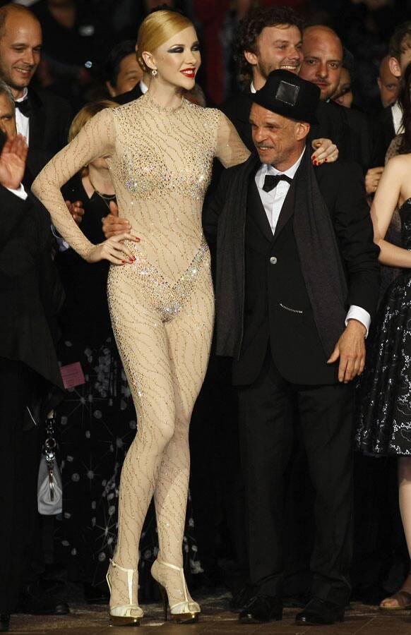 Actor Denis Lavant, right, and an unidentified performer arrive for the screening of Holy Motors at the 65th international film festival, in Cannes.