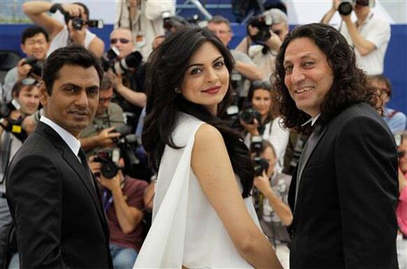 From left, actors Nawazuddin Siddiqui, Niharika Singh and Anil George pose during a photo call for Miss Lovely at the 65th international film festival, in Cannes.