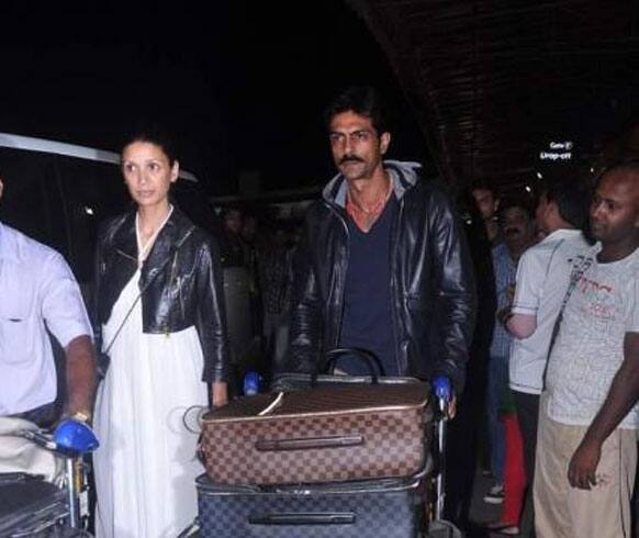 Arjun Rampal and wife Mehr Jessia spotted at the Mumbai airport. The couple left for Cannes on Thursday night. 