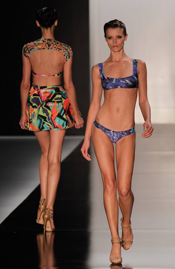 Models wear creations from the Lenny summer collection during Fashion Rio in Rio de Janeiro, Brazil.