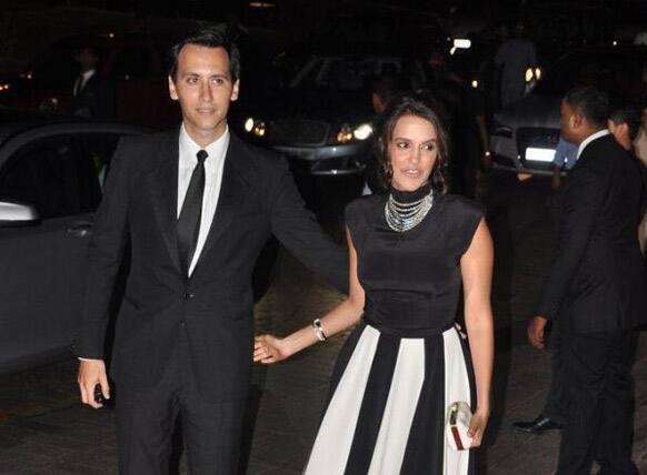 Neha looking fab in a black and white dress arrives with her boyfriend.