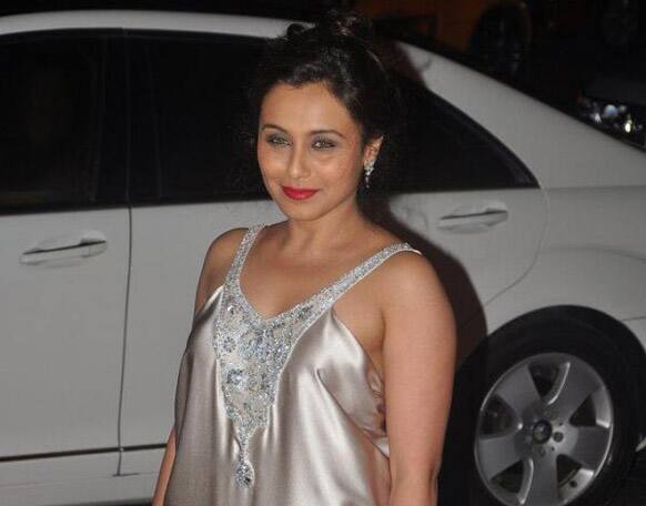 Rani Mukerji looks pretty wearing that silver dress and red pout.