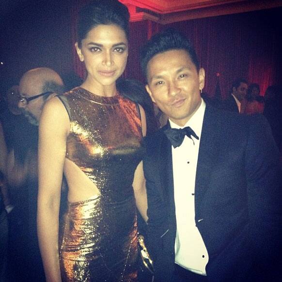 Deepika Padukone looked stunning in  a golden Prabal Gurung number. Here the actress poses with the designer at the party. Pic Courtesy: Twitter.